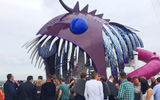 Passengers lined up for their turn on the Abyss. The entrance to the slides is through the mouth of this sculpture of an anglerfish.