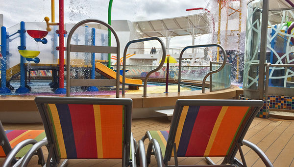 Kid-sized lounge chairs were set up next to the splash park. Kid-sized lounge chairs were set up next to the splash park.