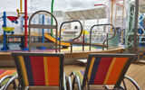 Kid-sized lounge chairs were set up next to the splash park.