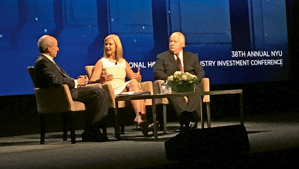 Jonathan Tisch, left, talks with the American Hotels & Lodging Association’s Katherine Lugar and the U.S. Travel Association’s Roger Dow. Jonathan Tisch, left, talks with the American Hotels & Lodging Association’s Katherine Lugar and the U.S. Travel Association’s Roger Dow.
