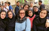 Iranian school groups visiting their country's historic and cultural sites are commonplace. So is their curiosity and warmth, says author Patricia Schultz, surrounded here by a cluster of high school girls who enthusiastically peppered her with questions about life in the U.S.