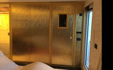 Behind this golden door is the in-suite sauna built into the 4,400-square-foot Regent Suite.