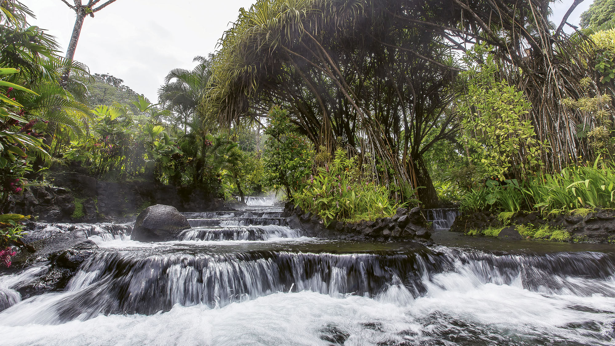 At the Tabacon Grand Spa Thermal Resort, hot springs and waterfalls are heated and fed by the Arenal volcano.