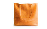 From FashionABLE, the handcrafted Mamuye Tote is made in Ethiopia completely of distressed leather. The bag, which measures 14 by 16 by 6 inches, features straps that have a 12-inch drop and a leather pouch with a snap enclosure. The company describes itself as an accessories brand that ''empowers women through sustainable opportunity and hope both in Africa and the U.S.'' through their collection that includes bags, scarves and jewelry.