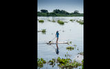 A woman goes paddleboarding on the Paraguay River on the outskirts of Corumba.