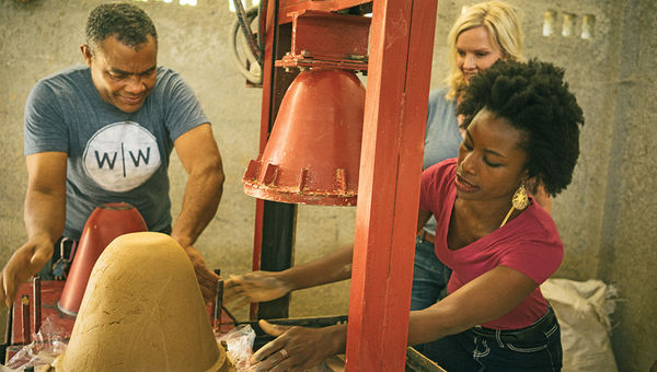 Volunteers help make ceramic water filters for improving water quality in the Dominican Republic.