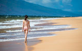Strolling along the two miles of secluded Polihua Beach.