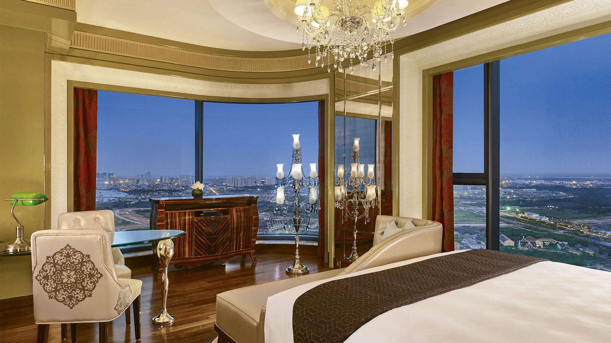 A Grand Deluxe King bedroom at the Reverie Saigon in Ho Chi Minh City.