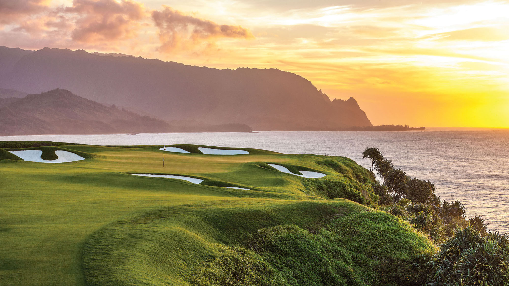The Makai Golf Course near the St. Regis Princeville resort on Kauai offers a stunning background during play.