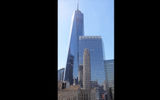 The reflection of the Four Season Downtown Hotel on 7 WTC with One World Trade Center behind it as seen from the 23d floor Tribeca Suite.