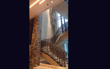 Yabu Pushelberg designed the hotel interiors like this spiral staircase and long chandelier at the Four Seasons Hotel New York Downtown.