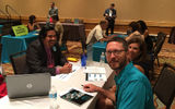 Jose Manuel Cerrud, left, owner of Terra Natura Travel in Ottawa, meets with suppliers at GTM Monday morning.