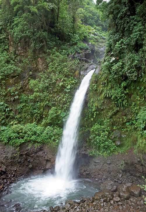 The La Paz Waterfall in Costa Rica is a series of seven falls, but from the bottom only the final one is visible. The La Paz Waterfall in Costa Rica is a series of seven falls, but from the bottom only the final one is visible.