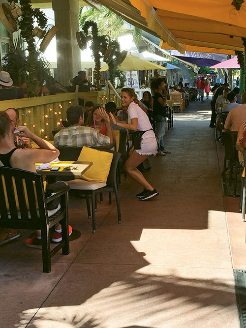 The outdoor cafes on Ocean Drive were still bustling despite the outbreak. The outdoor cafes on Ocean Drive were still bustling despite the outbreak.