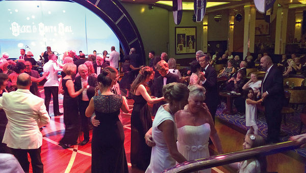 Ballroom dancing is a focal point of evenings on the Queen Mary 2, particularly on themed formal nights, such as black-and-white night. Many passengers head to the Queens Room, which Cunard says offers the largest dance floor at sea. Ballroom dancing is a focal point of evenings on the Queen Mary 2, particularly on themed formal nights, such as black-and-white night. Many passengers head to the Queens Room, which Cunard says offers the largest dance floor at sea.