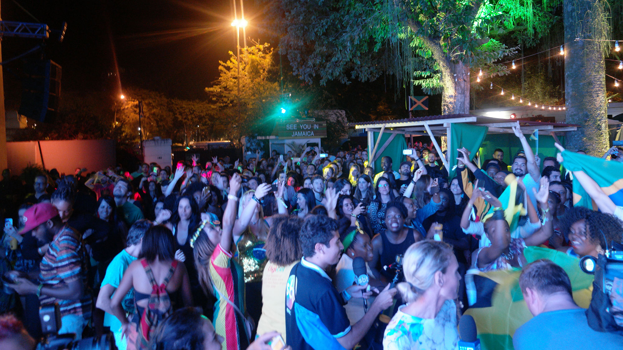 Jubilant fans at Jamaica House in Rio celebrate after Usain Bolt assists the men's 4x100m relay team to victory.