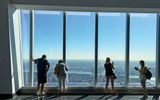 Tourists take in the view from the observatory at One World Trade Center.