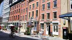 The South Street Seaport district is emblematic of the mix of old and new that visitors find in lower Manhattan. Above, Front Street.
