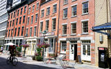 The South Street Seaport district is emblematic of the mix of old and new that visitors find in lower Manhattan. Above, Front Street.