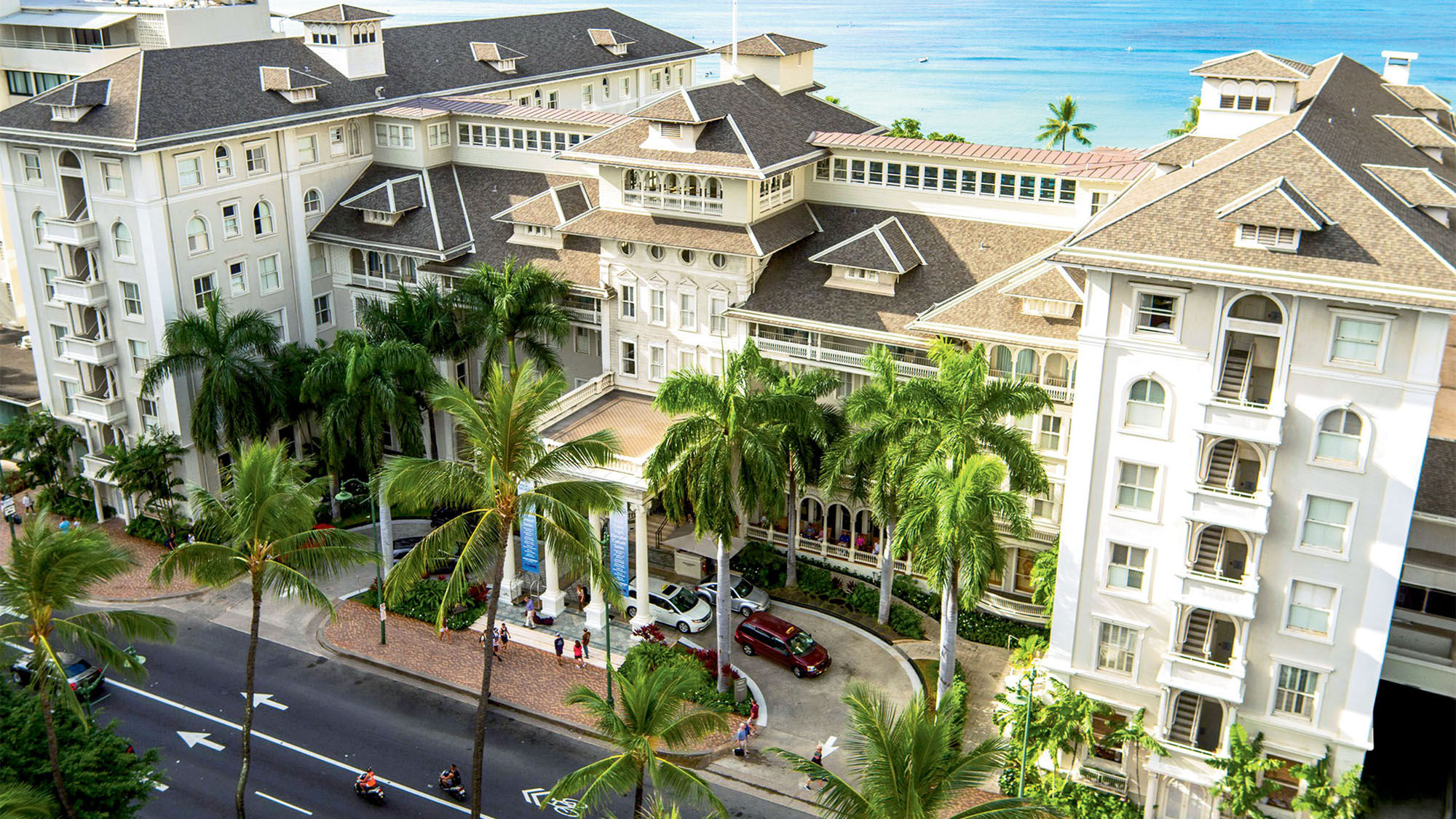 The Kalakaua Avenue entrance of the Moana Surfrider, a Westin Resort & Spa, which is celebrating its 115th anniversary.