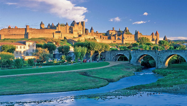 The view of Carcassonne, France, from the Canal du Midi. It is known for Le Cite, its hilltop, medieval citadel. The view of Carcassonne, France, from the Canal du Midi. It is known for Le Cite, its hilltop, medieval citadel.