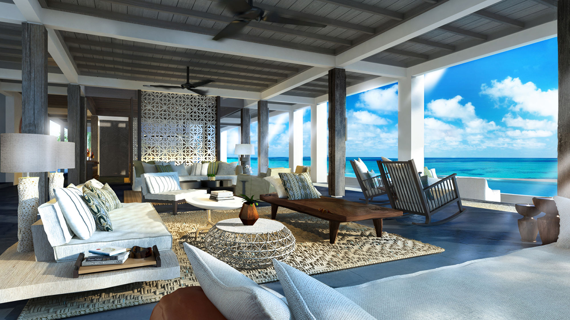The living room in the Beach House at the Four Seasons Private Island Maldives at Voavah.