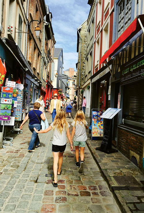 The author’s children make their way down a Honfleur street. The author’s children make their way down a Honfleur street.