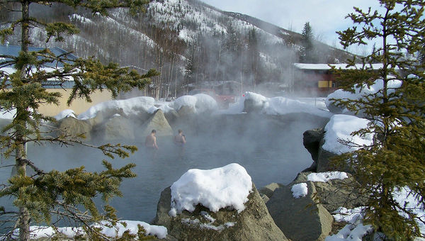 A couple in the outdoor hot springs pool.