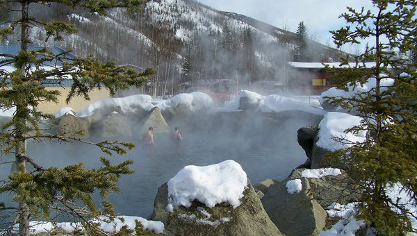 A couple in the outdoor hot springs pool. A couple in the outdoor hot springs pool.