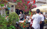 Serbians and tourists alike enjoy traditional national cuisine and Roma music on a Sunday afternoon along the pedestrian Skadarlija Street in Belgrade's old town.