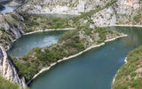 In the distance, kayakers make their way through the snaked passageways of the Uvac Nature Reserve in western Serbia.