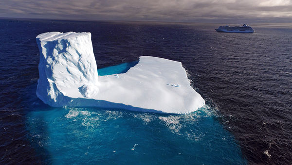The Crystal Serenity passes by an iceberg in Canada’s Bellot Strait, along the Northwest Passage. The Crystal Serenity passes by an iceberg in Canada’s Bellot Strait, along the Northwest Passage.