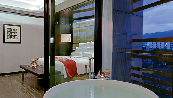 The bedroom of a Deluxe Suite guestroom. The bedroom of a Deluxe Suite guestroom.