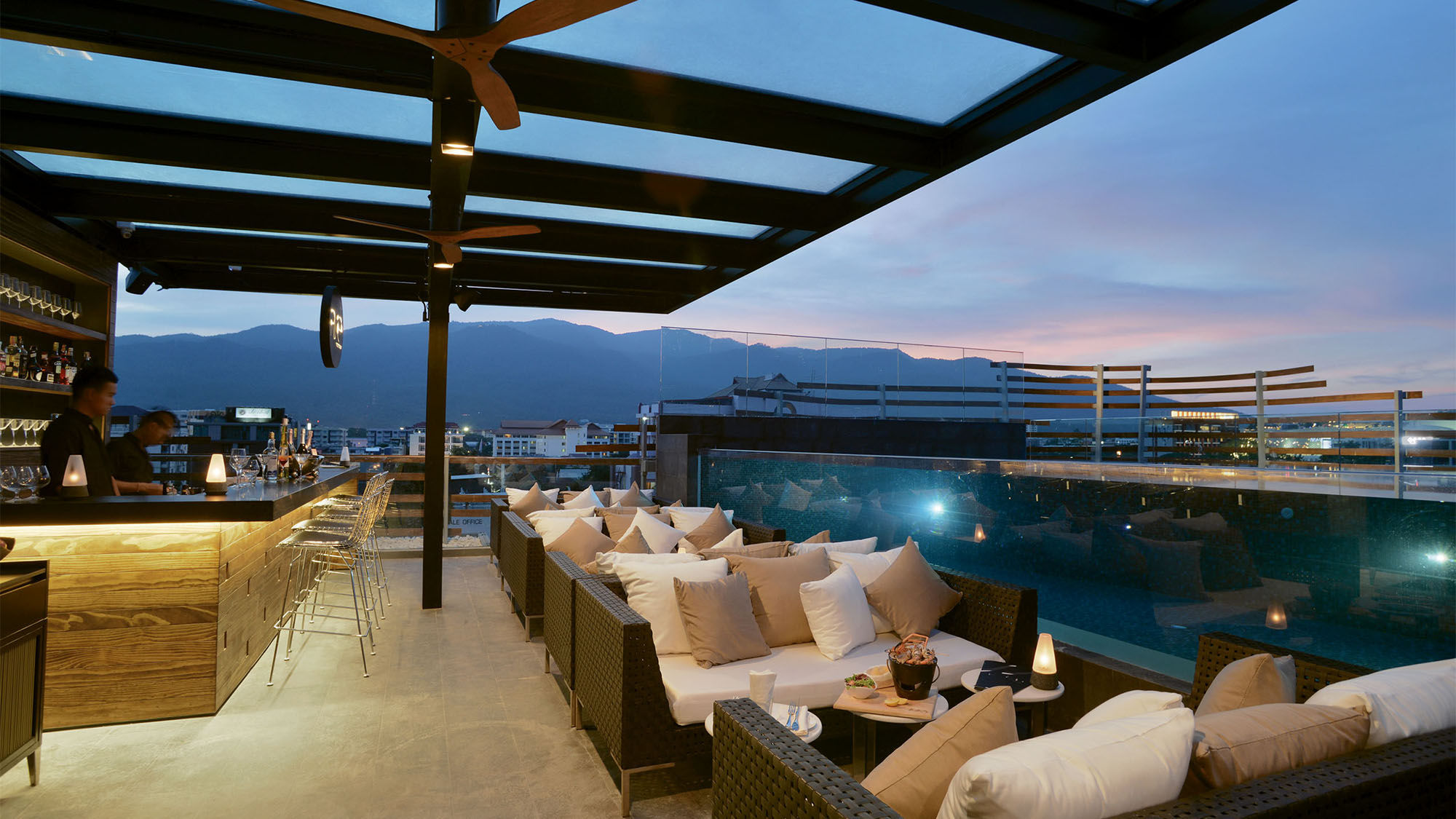 The Rise Bar is next to an infinity pool on the rooftop of the Akyra Manor Chiang Mai in Thailand.