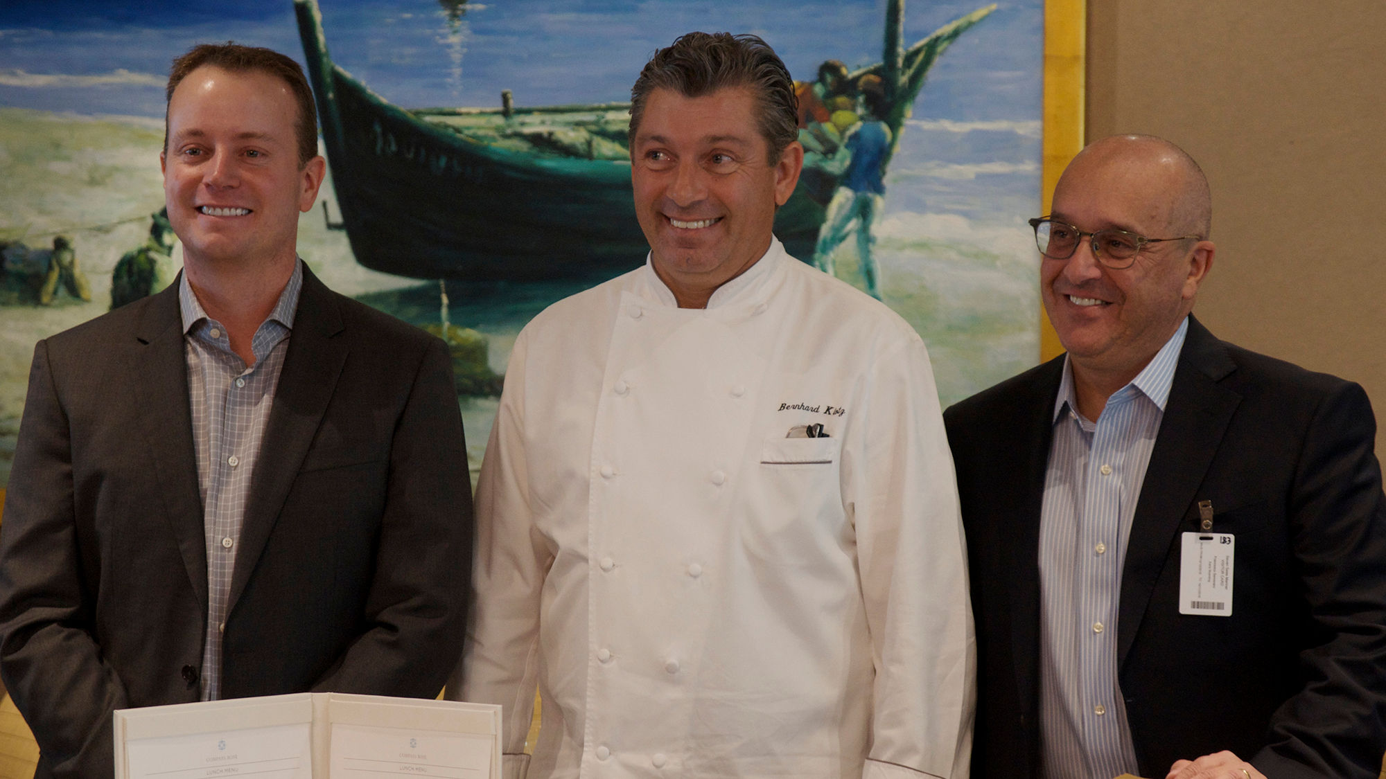 From left, Regent Seven Seas Cruises CEO Jason Montague, senior vice president of hotel operations Franco Semararo, and senior director of culinary operations Bernhard Klotz in the Compass Rose restaurant aboard the Seven Seas Mariner.
