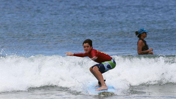 A boy rides the shore break at Hanalei Bay with Hawaiian Surfing Adventures. The company offers a four-hour Children of the Sea Surf Camp for ages 8 and older. A boy rides the shore break at Hanalei Bay with Hawaiian Surfing Adventures. The company offers a four-hour Children of the Sea Surf Camp for ages 8 and older.