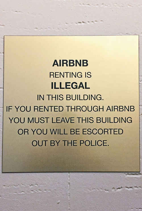 Signs such as this have been placed in some residential buildings in Manhattan.
