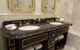 Guestroom bathrooms feature Italian marble and brass fixtures.