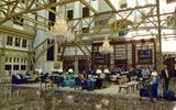 The defining feature of the 263-room hotel is its soaring, nine-story atrium lobby, called the Cortile, with a 200-foot-high glass ceiling. On one end of the Cortile floor is the Benjamin Bar and Lounge, with all-day dining and 17 kinds of champagne.