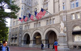 The facade of the Trump International Hotel Washington, D.C., which has a statue of Benjamin Franklin in front.