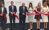 Donald Trump and his family officially opened the Trump International Hotel Washington, D.C. with an Oct, 26 ribbon-cutting ceremony. At the ceremony commemorating the official opening, the Republican presidential nominee was flanked by sons Don Jr. and Eric, and wife Melania, and daughters Tiffany and Ivanka.