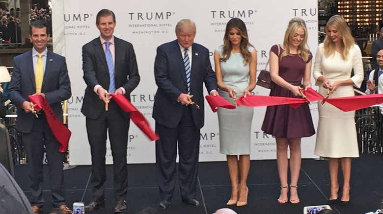 Donald Trump and his family officially opened the Trump International Hotel Washington, D.C. with an Oct, 26 ribbon-cutting ceremony. At the ceremony commemorating the official opening, the Republican presidential nominee was flanked by sons Don Jr. and Eric, and wife Melania, and daughters Tiffany and Ivanka.