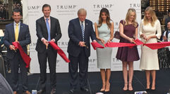 Donald Trump and his family officially opened the Trump International Hotel Washington, D.C. with an Oct, 26 ribbon-cutting ceremony. At the ceremony commemorating the official opening, the Republican presidential nominee was flanked by sons Don Jr. and Eric, and wife Melania, and daughters Tiffany and Ivanka.