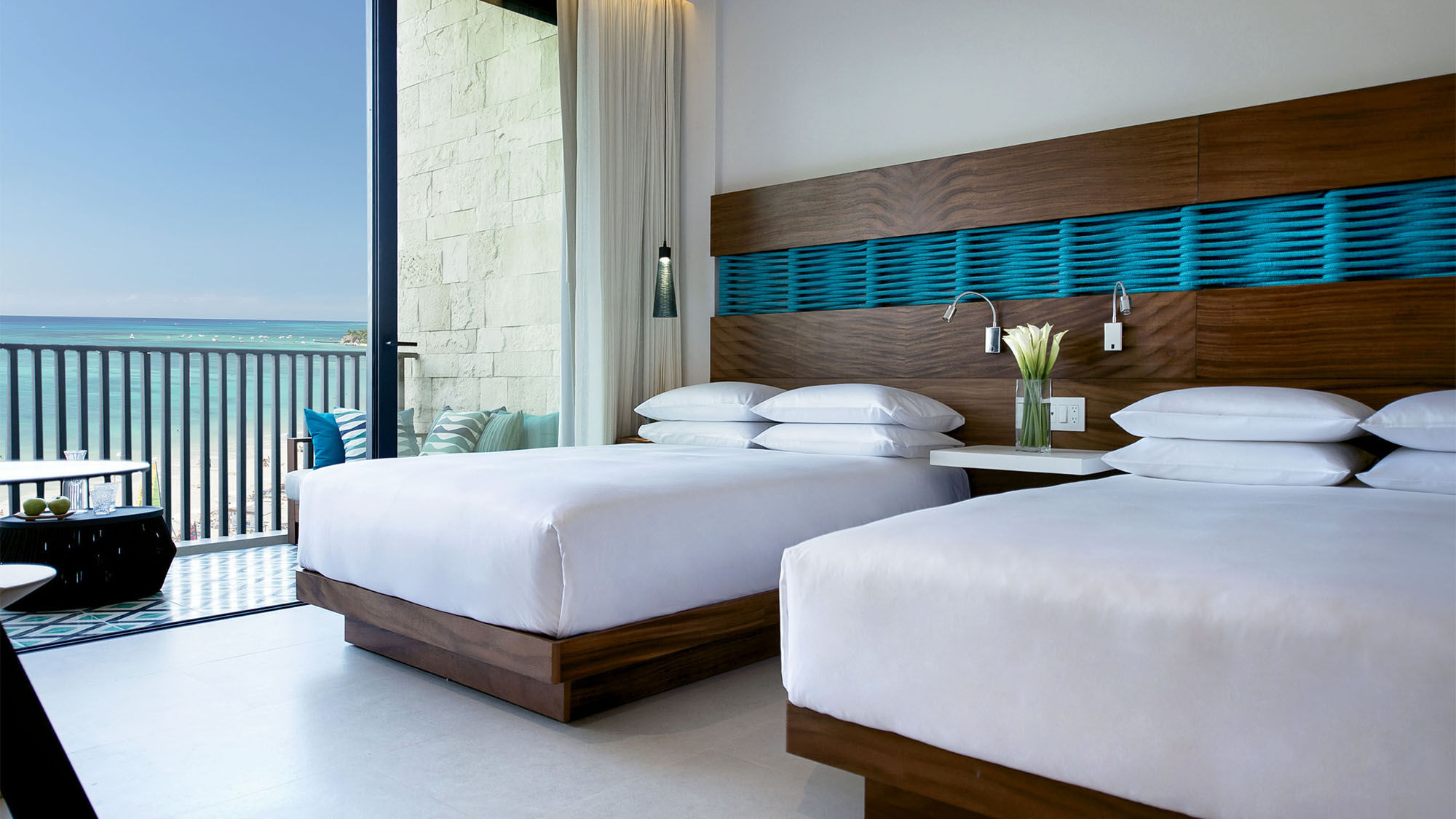 A Grand Queen room at the Grand Hyatt Playa del Carmen, which comes with a furnished balcony.