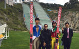 The author with members of the South Korean ski-jump team and Choi Il Hong, the manager of the Olympic Business Division, at Alpensia.