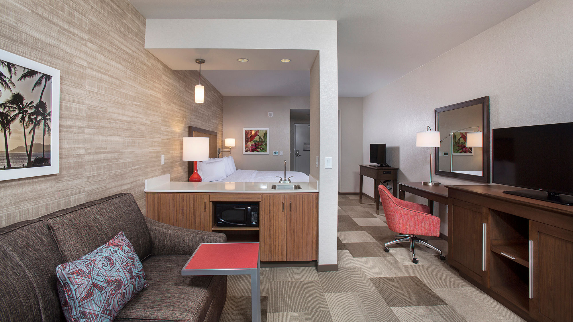 A guestroom at the Hampton Inn & Suites by Hilton Oahu-Kapolei.