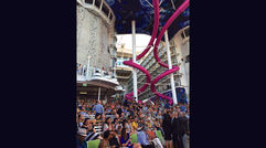 The Royal Caribbean International ship was named Nov. 10 in Fort Lauderdale in an event that included cameo appearances by an aerialist and one of the ship's robotic bartenders, as well as a musical performance and the christening itself by Teach for America educator Brittany Affolter. Pictured here, guests began to gather in the Aqua Theater for the naming ceremony.