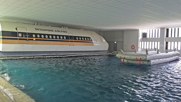 Singapore Air trainees must jump from a model plane into the wave pool and then make it to the raft as part of water landing exercises. Singapore Air trainees must jump from a model plane into the wave pool and then make it to the raft as part of water landing exercises.