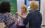 At the exhibitor showcase, Wendy Graziano, a Nexion representative, spoke with agents about the host agency.