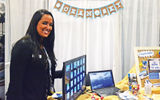 Lillian Lens, a representative of Ocean Sky Hotel & Resort, at her booth.